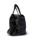 Black backpack with gold zippers on a white background