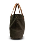 Green tote bag with brown handles on a white background
