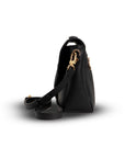 Black handbag with gold zipper on a white background
