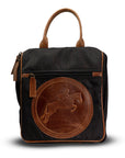 Black backpack with brown leather patch featuring a horse emblem on a white background
